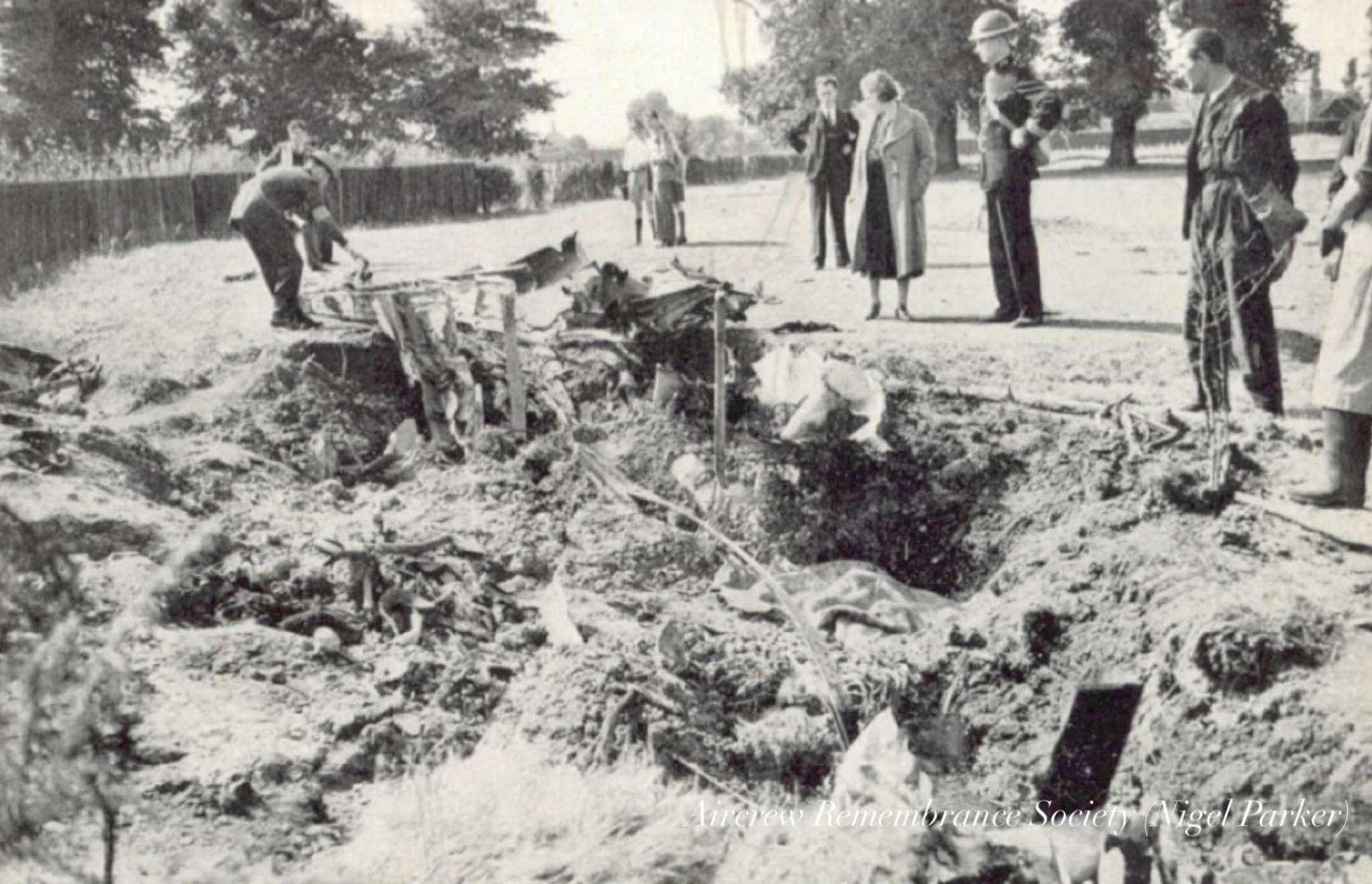 The aftermath of the crash, just a slit in the ground with very little wreckage on the surface.