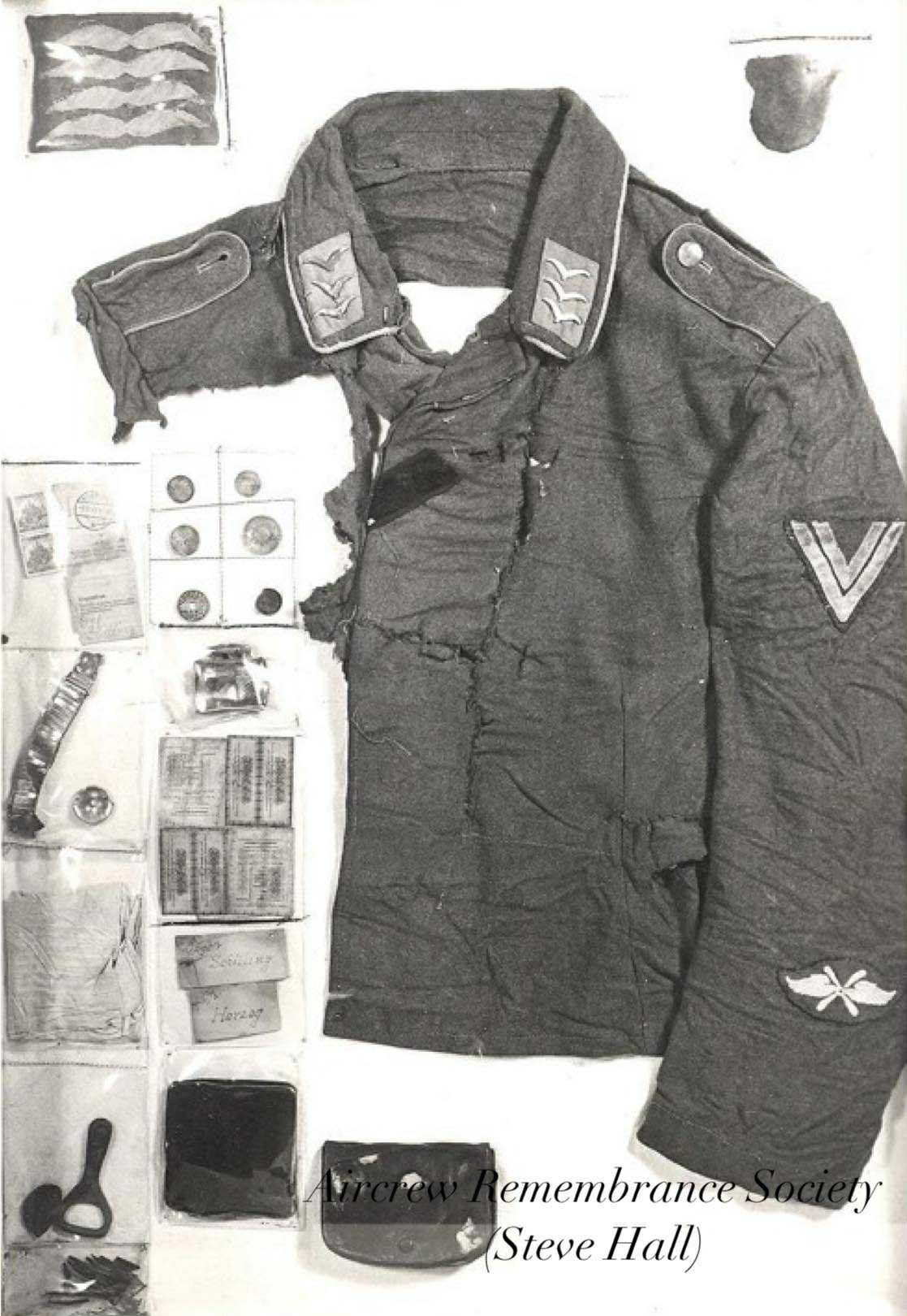 Luftwaffe uniform fragments belonging to Obgfr. Herbert Schilling , recovered from crash site during 1976 (Hall)