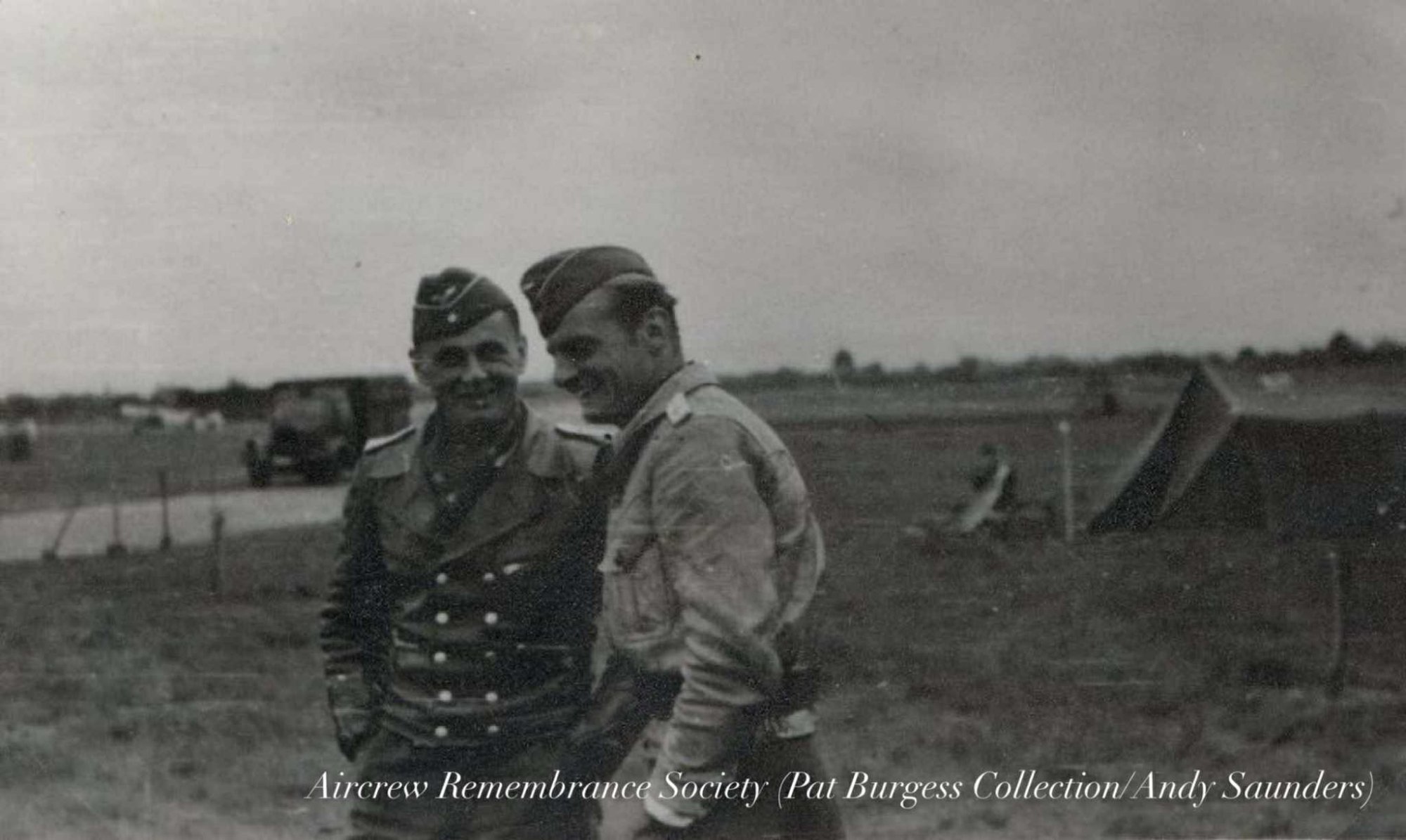 Oblt. Volk pictured on the left with leather flying jacket. (Pat Burgess Collection/Saunders)