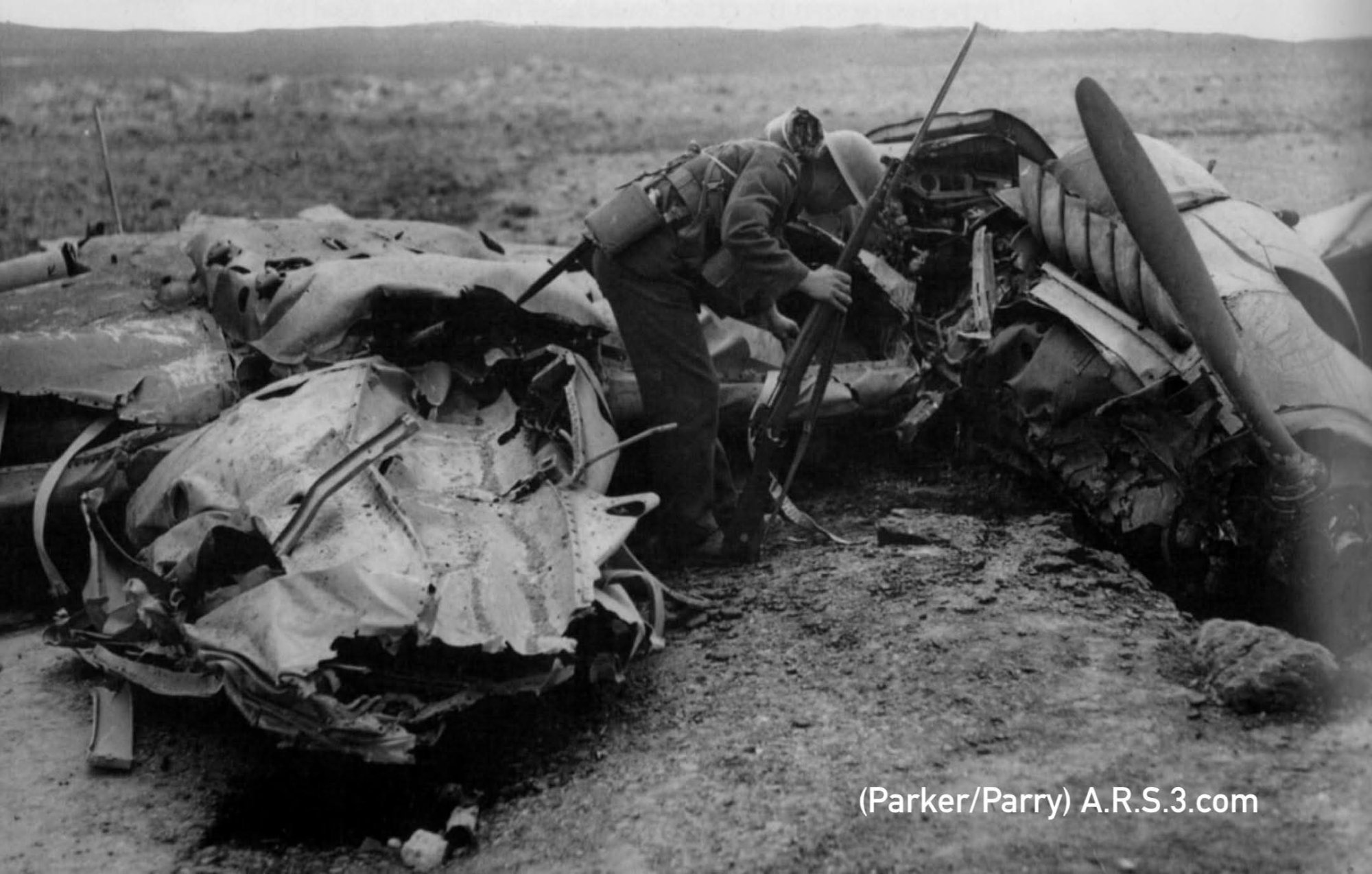 A soldier examines the wreckage of Hans Steding’s Messerschmitt at Manston. (Parker/Parry)