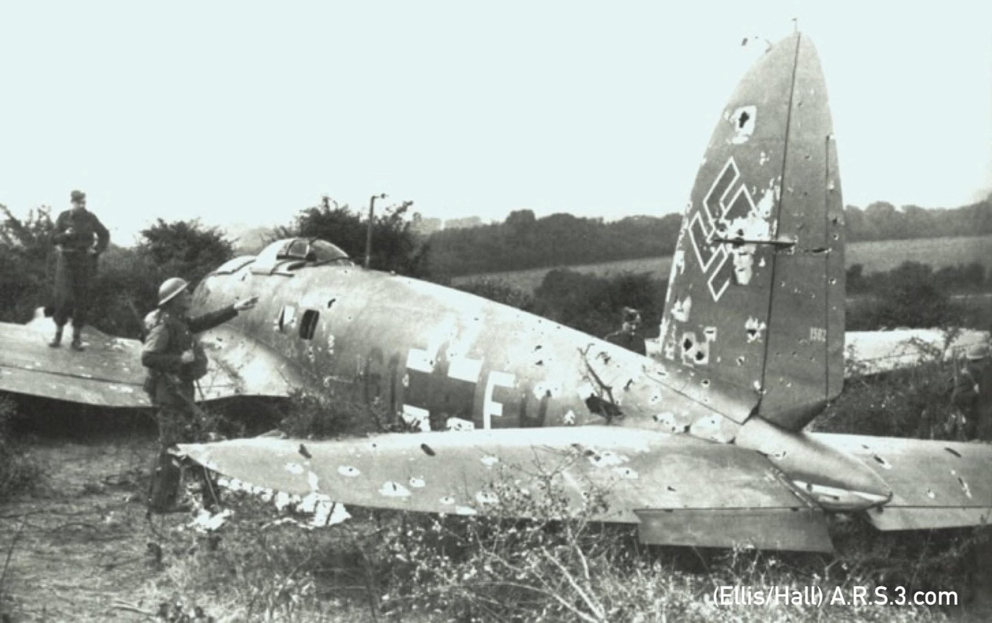 The wreck of Lt. Theopold's He 111 rests in the field bullet ridden (Ellis/Hall).