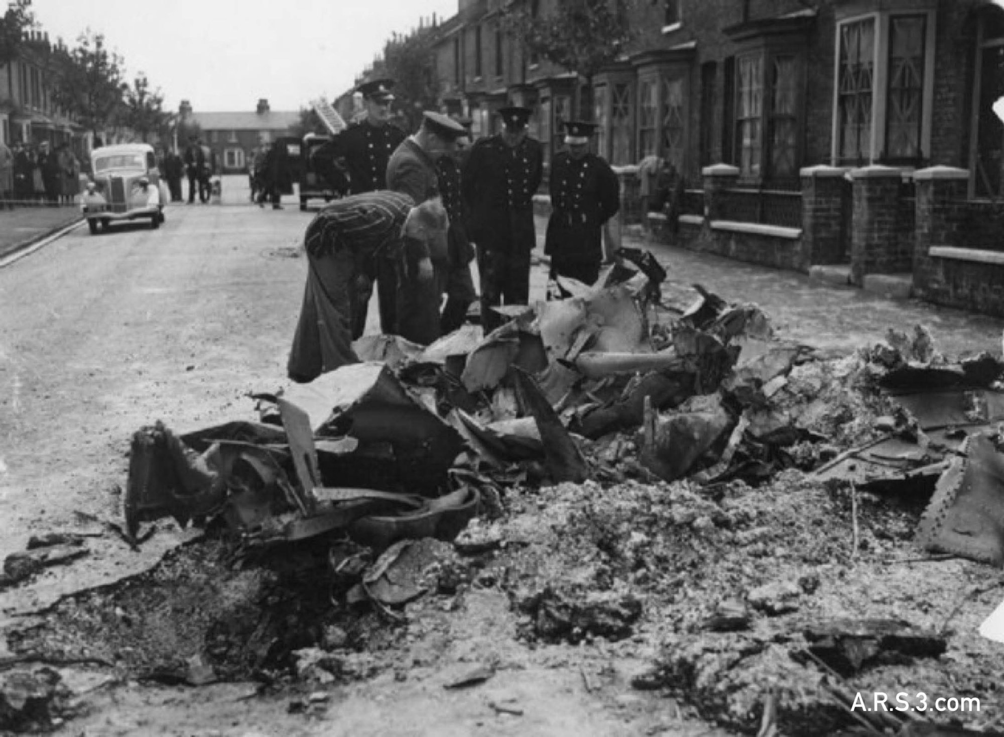 Wreckage in Byron avenue inspected by police and others.