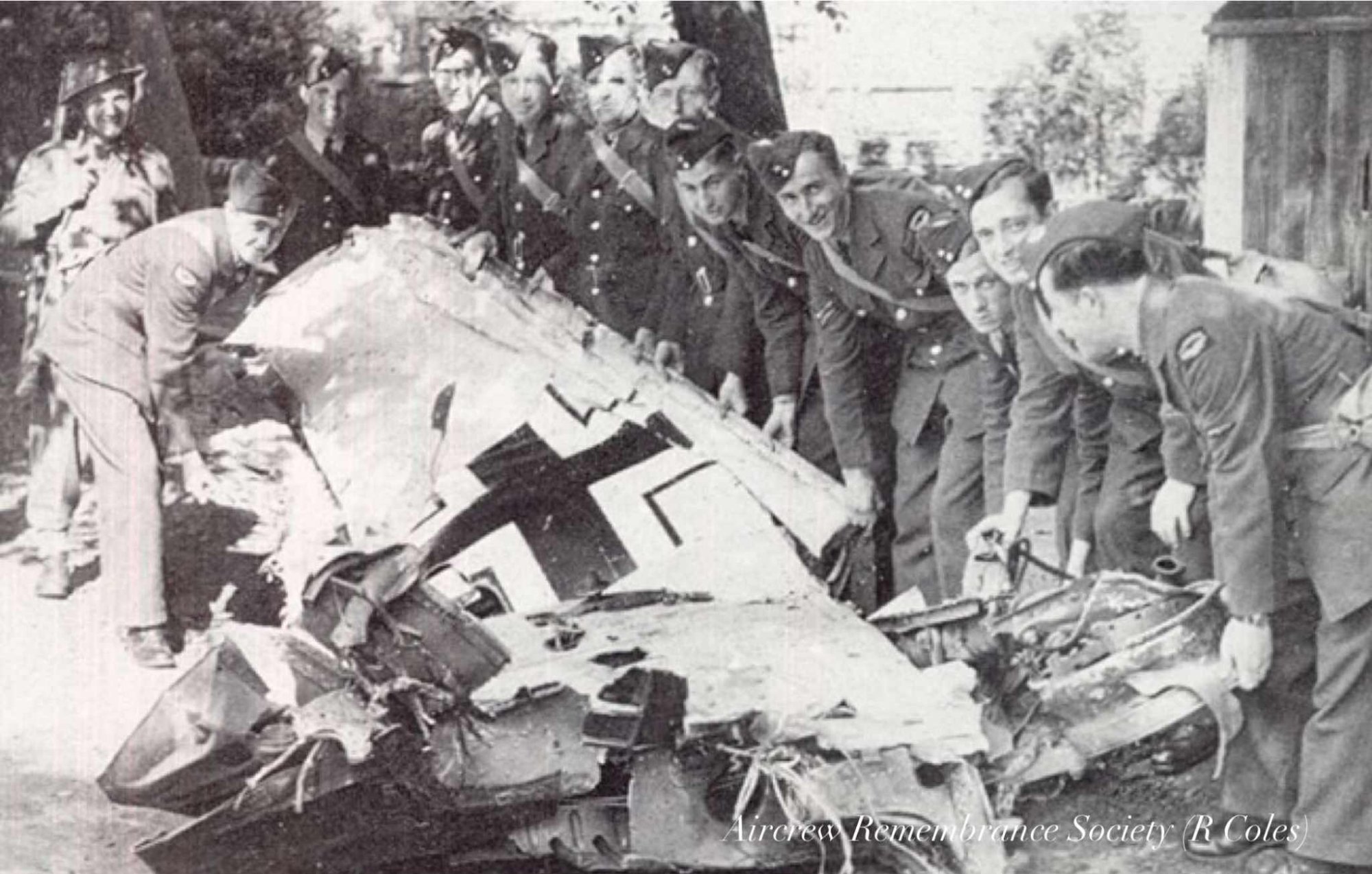 Canadian Servicemen doing their bit to clear the wreckage of Uffz Schmidt's machine (R Coles)