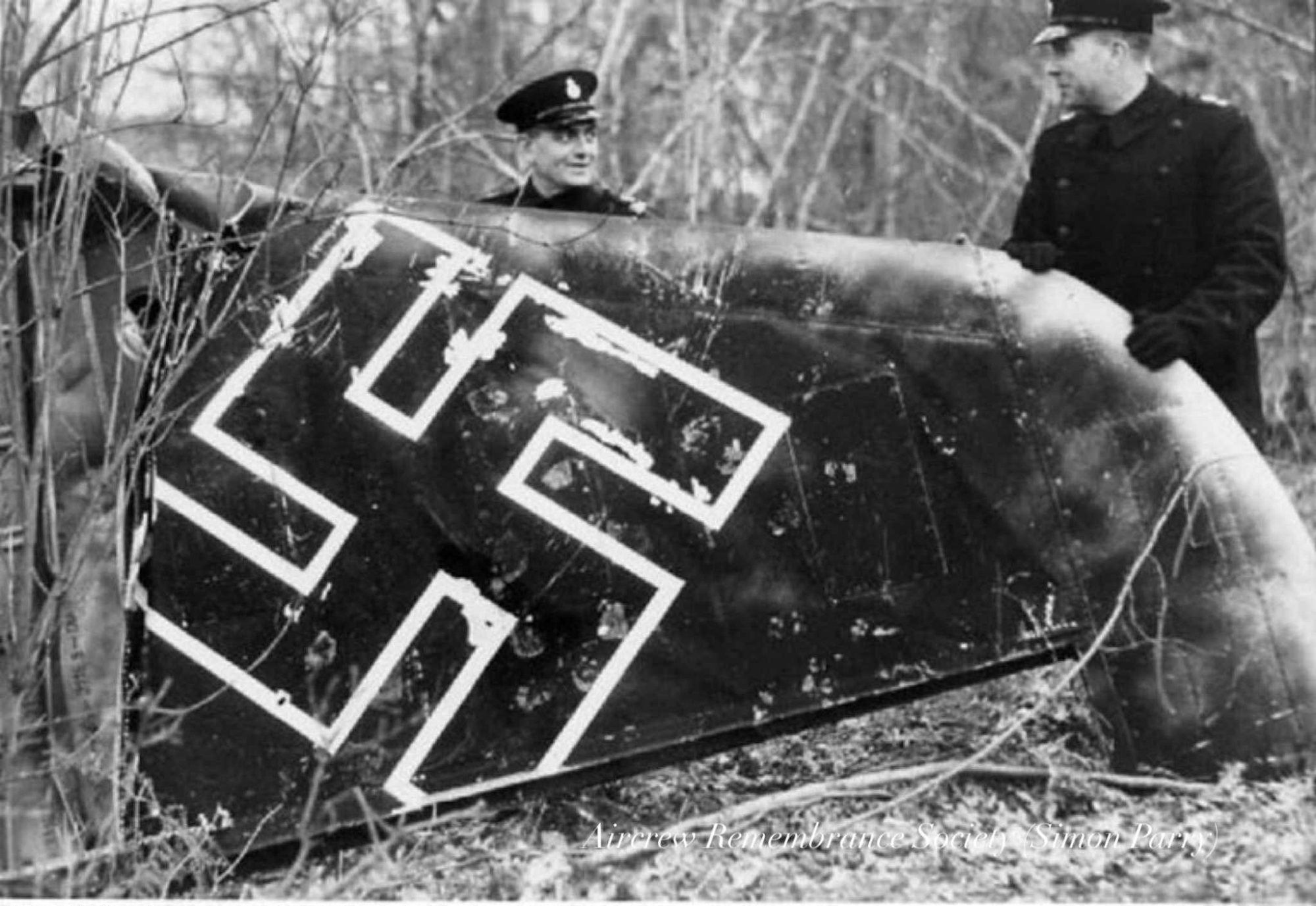 The tail of the aircraft in the hands of the local police (Parry)