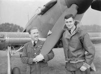 Flight-Lieutenant M H Brown and Pilot Officer Chetham of No.1 Squadron RAF standing by the nose of a Hawker Hurricane Mark I at Wittering, Huntingdonshire. (IWM)
