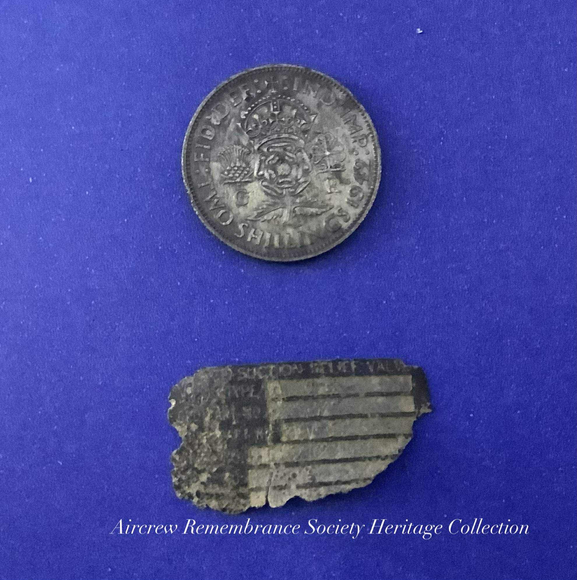 Two Shillings Coin and Label recovered from the crash site of Boeing B-17G Flying Fortress 42-31469