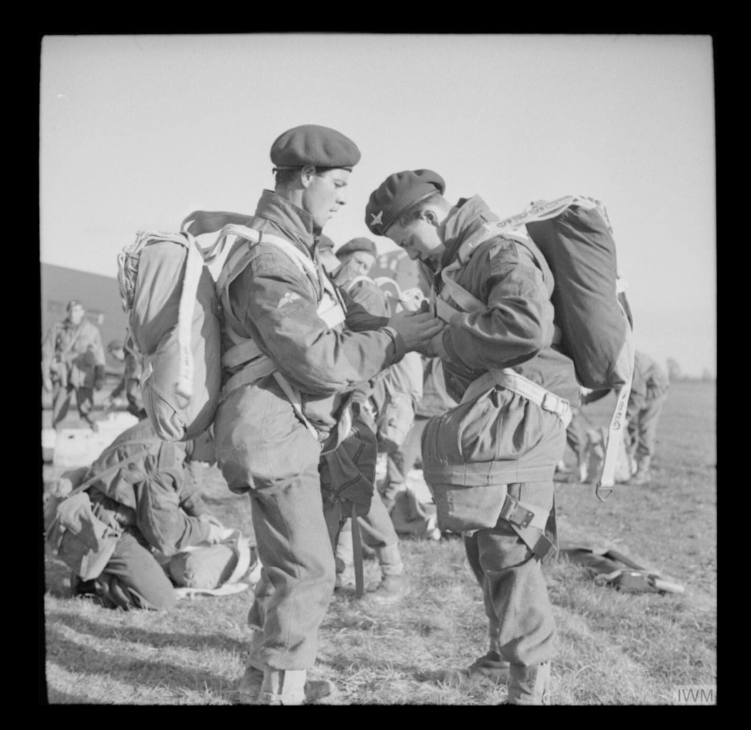 Edward Bate (Left), of Wishaw, Lanarkshire, Scotland, preparing for a large Airborne exercise on the 22nd April 1944 IWM