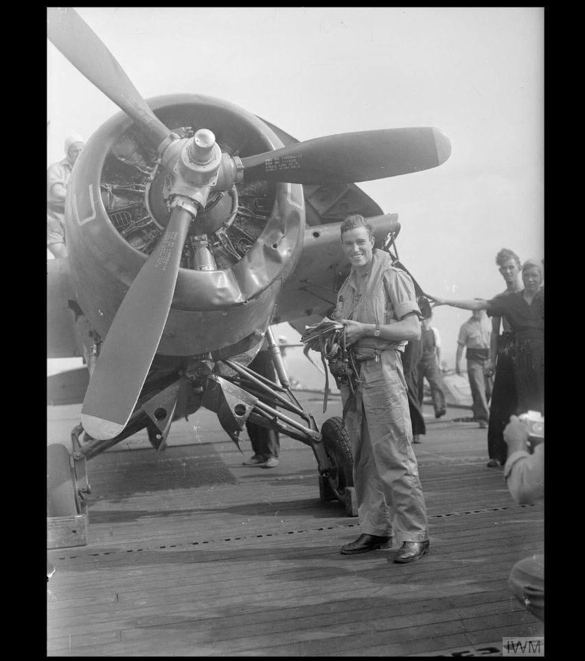 Sub Lieut (A) B A Lawrence beside his damaged Wildcat after landing on H.M.S. Pursuer (Photo I.W.M.)