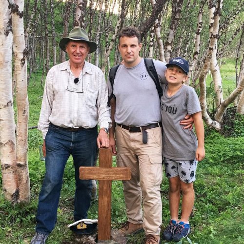 Three generations of Richardson family planted a cross by the unmarked former grave near Lt Cmdr Ron Richardson's crashed Hellcat aircraft. Pictured is Ron's son Alistair with his son Philip and his grandson
