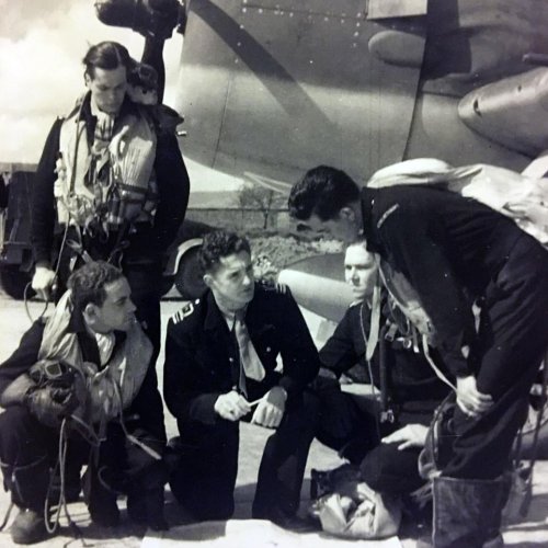 Pictured is Ron briefing fellow pilots. He travelled to Britain and joined the Royal Navy's Fleet Air Arm before training as a pilot. He spent more than three years flying Seafires and Hellcats from aircraft carriers, notably in the Mediterranean