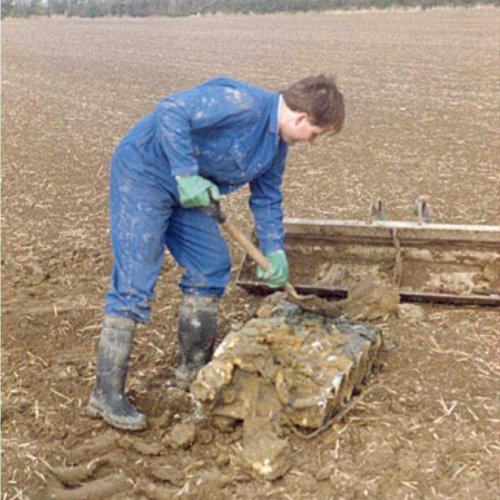 Martin “Buzz” O’Brien cleaning the recovered cylinder block & head from one side of the Jumo 211 engine. (Brownless)