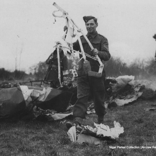 The code letter “A” can clearly be seen on this piece of wreckage pictured beside this corporal. (Nigel Parker).