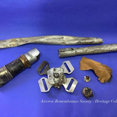 A collection of interesting artefacts recovered from the crash site currently held in our Heritage Collection. Including Parachute Release, Dinghy Paddle Handle, Control Column Direction Selector part of the Auto Pilot system and other items.