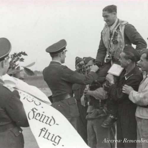 Major. Kopper the Gruppenkommandeur of 1./(F)123 congratultes Karl Rueck on his return from his 100th war flight.