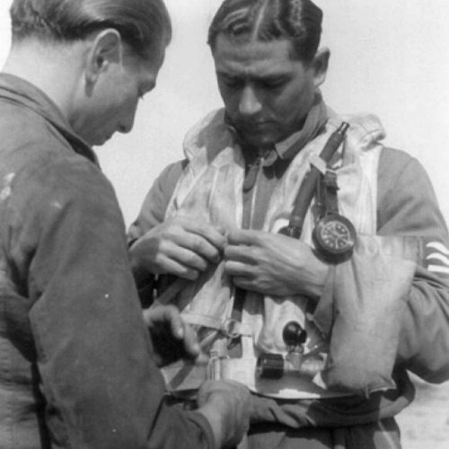 Karl Rueck is prepared for his next mission by his ground crew (Knoedler)