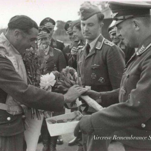 Major. Kopper the Gruppenkommandeur of 1./(F)123 congratultes Karl Rueck on his return from his 100th war flight.