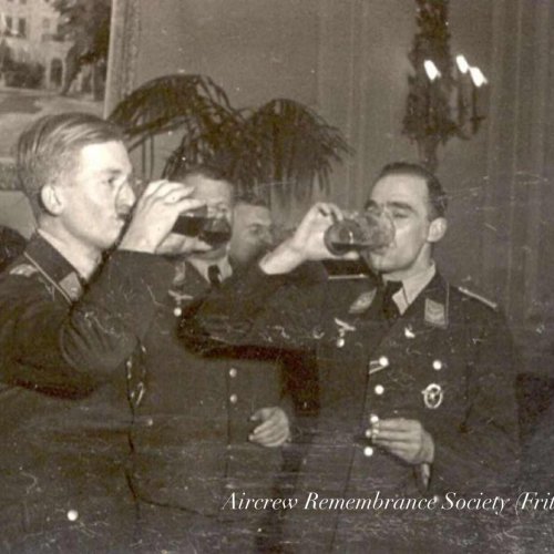 “Charly” Rüeck & Fritz Schlichting with comrades celebrating at Chateau Buc.
