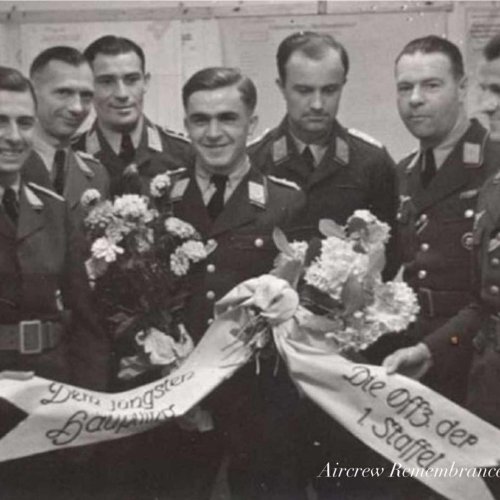 Veteran observer of the 1./Staffel, Hptm. Berndt is congratulated by his comrades.