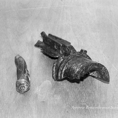 A 13 mm round of ammunition together with an MG fragment. (Brownless).