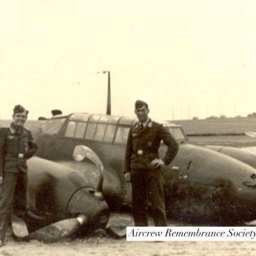 Herbert Platzek & Karl Haisch stand beside the D5 + HH? Possibly crash landed aircraft. (Hall)