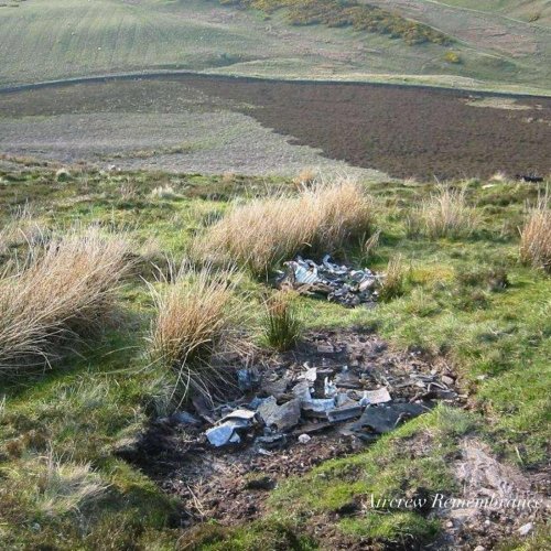 General views of the crash site area with many small fragments still strewn around.

