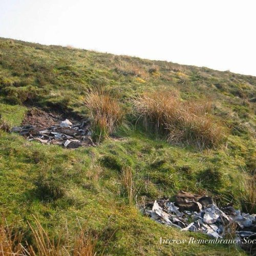 General views of the crash site area with many small fragments still strewn around.
