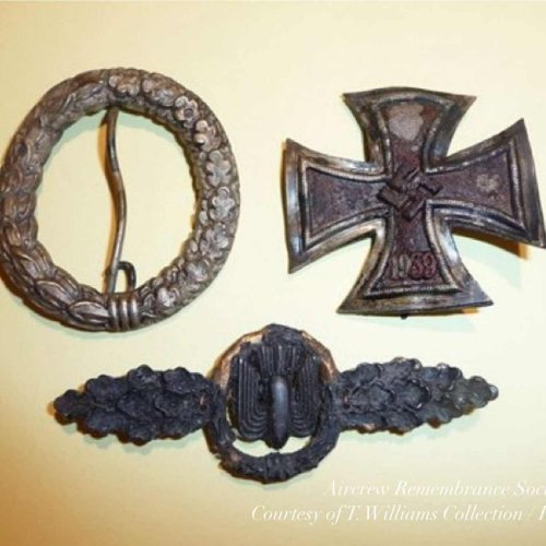 Crew related finds, part of a qualification badge, Iron Cross 1st Class and a bomber war flights clasp.