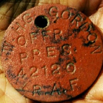 A very poignant and invaluable find P/O Gordon's ID disc confirming identity (via C. Ellis)