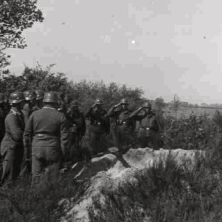 The crew were first buried in this field grave, at the edge of the field where the Hampden crashed.
This photo shows the dignity and respect shown by the Luftwaffe to allied aircrews.
