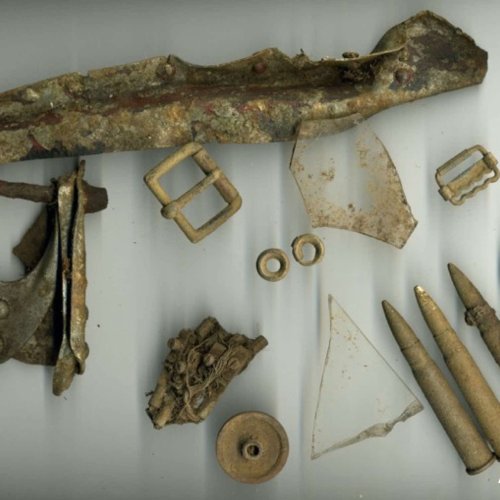 In 1980s Crash site was located in woodland and small fragments were found littering the surface.
Relics included three complete .303 rounds of ammunition, shattered and burnt perspex, oxygen mask adjustment clip,
a small part of geodetic structure and various other small pieces (Brownless).
