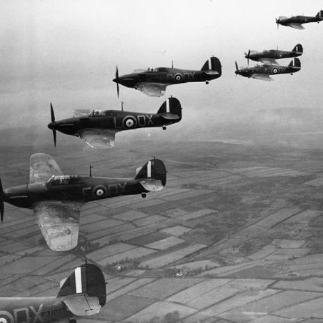 Hurricane Mk Is of No. 245 Squadron, in flight from Aldergrove, near Belfast, November 1940.
The lead aircraft is P3101 DX-?, the mount of the CO, Squadron Leader J. W. C. Simpson.