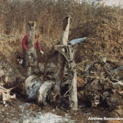 Our Chairman David King partly obscured by main undercarriage of Hampden L4203 during the aircrafts recovery, which took place between October 1981 and May 1982. The aircraft was dug totally by hand which resulted in 95% of the aircraft being recovered.